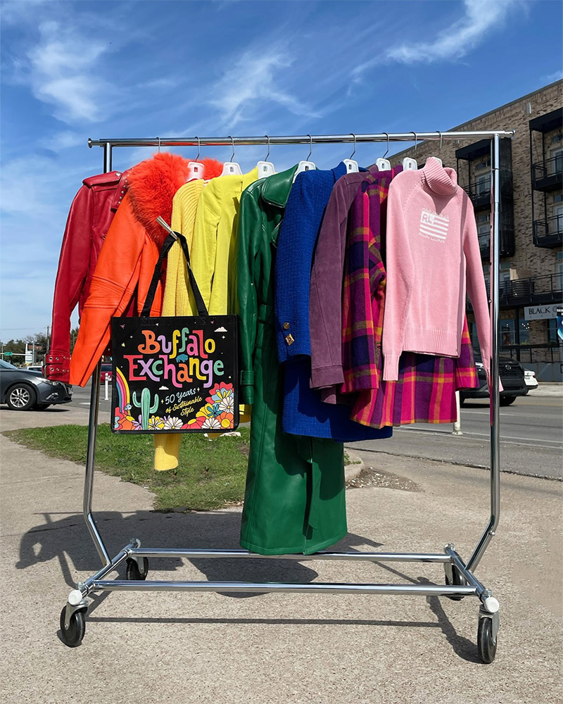 rack of rainbow clothes