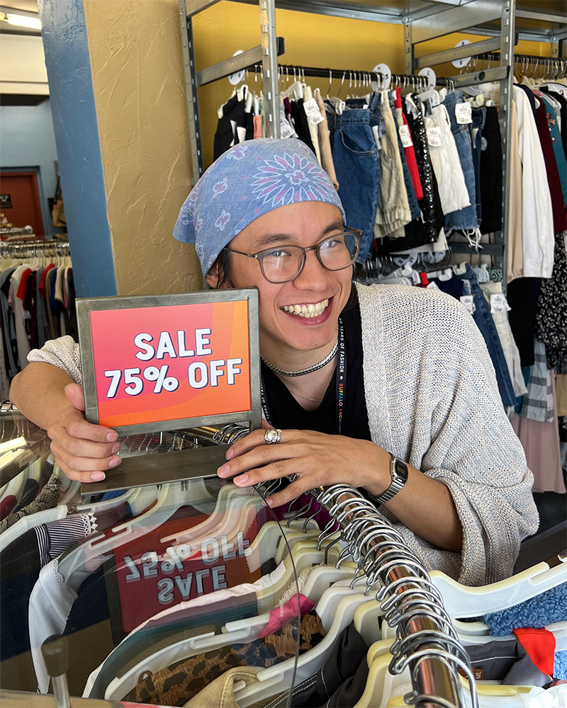 BE employee with sale sign 